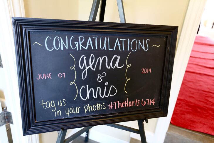 A chalkboard sign at the reception congratulated the newly wedded couple. A social media sharing hashtag was provided for guests to be able to share their photos with.
