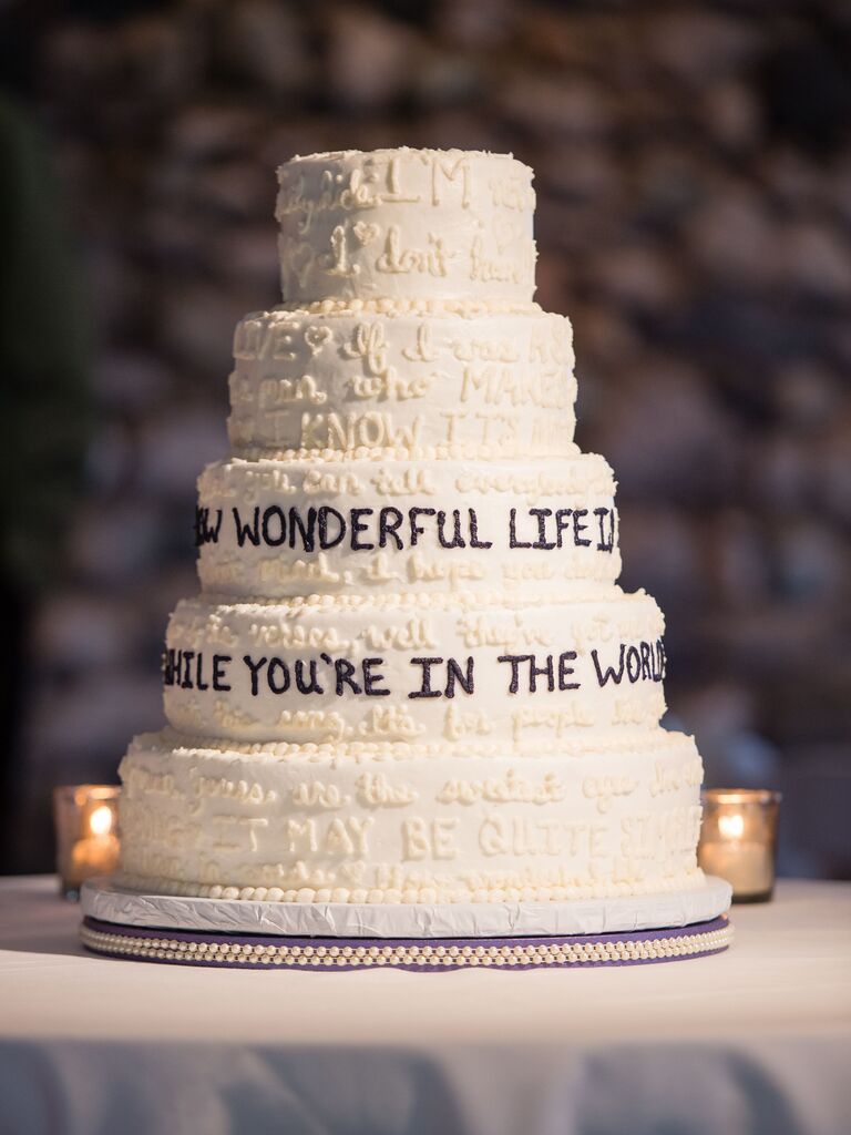 Wedding cake with song lyrics on it. 
