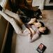 Couple Snuggling on the Floor With Dog