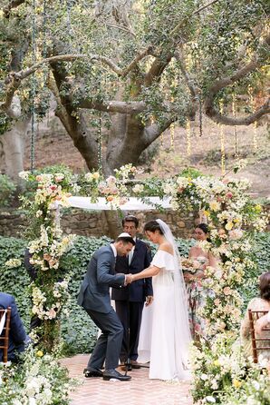 Jewish Ceremony Under Huge Tree, String Lights, and Groom Breaking the Glass