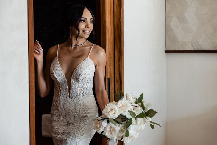 Bride in Plunging Neckline Wedding Dress With Beading