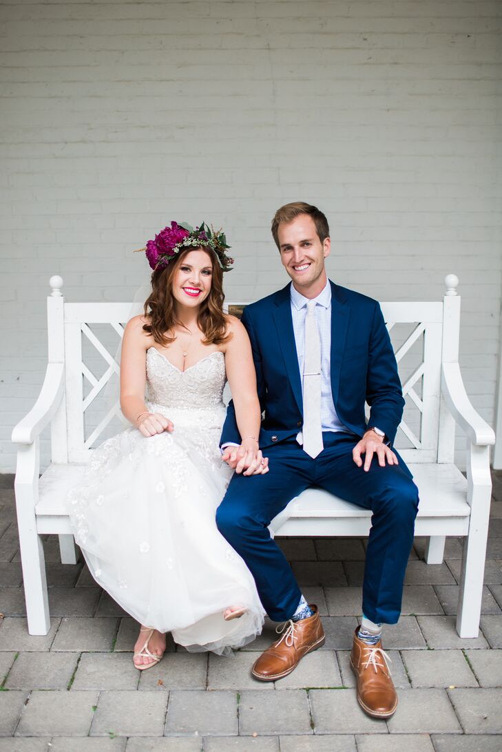 Andi paired her strapless gown with a bohemian headpiece, while Eric opted for a sharp navy suit.