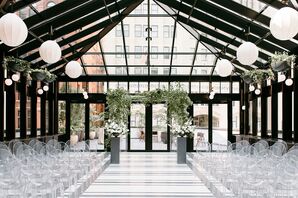 Atrium With Ghost Chairs and Greenery-Covered Chuppah at the Shinola Hotel in Detroit, Michigan
