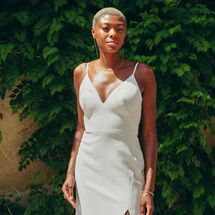 Bride in minimalist V-neck dress with slit