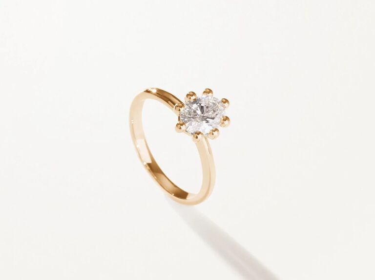 simple oval engagement ring on unique eight-prong setting