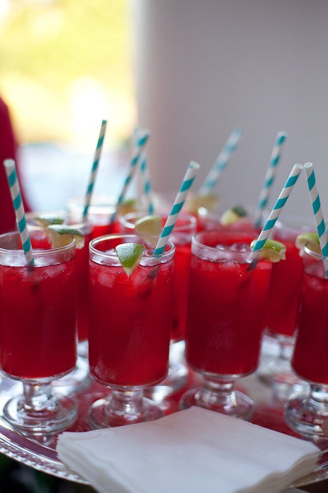 Vivid red cocktails were created in keeping with the bride's color palette for cocktail hour.