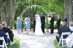 Flowery Wedding Arch at Springtime Ceremony