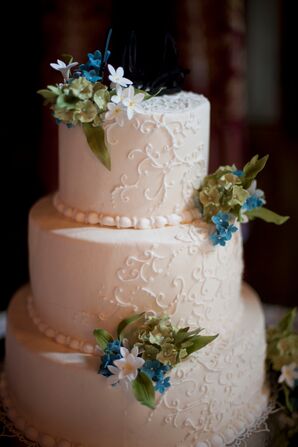 Ivory Wedding Cake With Green, Blue and White Flowers