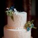 Ivory Wedding Cake With Green, Blue and White Flowers