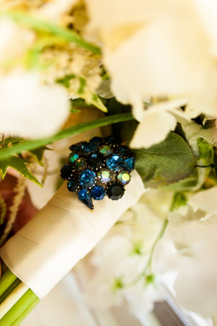 Ashley's grandmother gave her a blue crystal pin to add to her white bouquet as her something borrowed and something blue.
