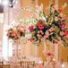 The couple's florist created tall centerpieces with sweet pink florals and hanging crystals.