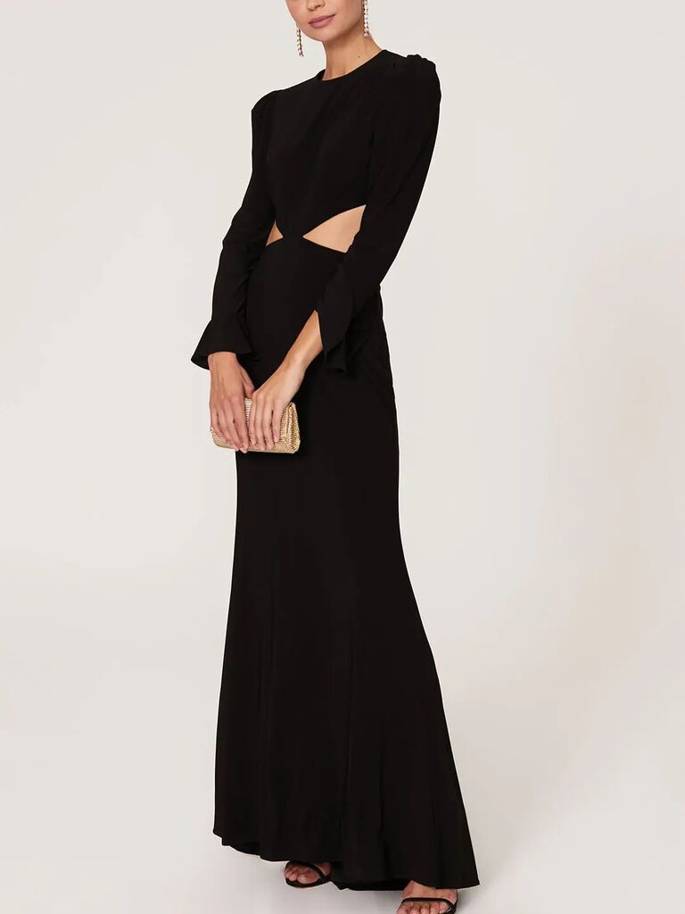 black formal or black-tie wedding guest dress with long sleeves and stomach cutouts