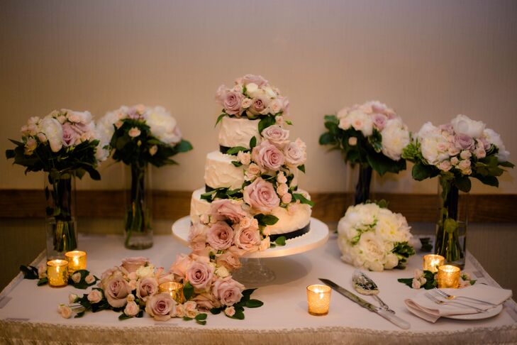 “It was a masterpiece,” Emily says. “The three-tier cake that Tracey Wilson, from Wilson's Tracey-Cakes, designed for us was absolutely breathtaking and exactly what I envisioned.” Covered in buttercream frosting, each layer of vanilla, chocolate or lemon cake was separated by raspberry or mocha filling. Cascading mauve and ivory roses even extended past the base into a pool of roses at the head of the table. Its added leaves were accented by hunter green ribbon wrapped around the confection.