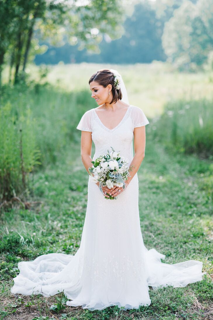 In search of a more natural look, the bride wore her hair half up with a long veil.