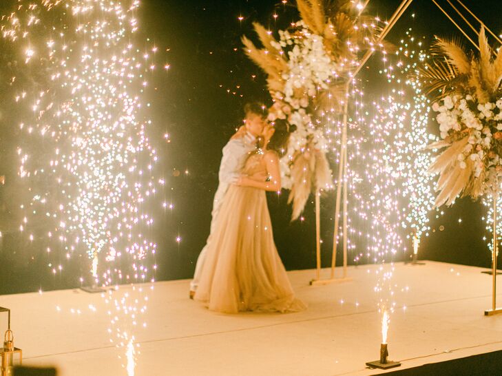 For Suki and Sing's "boho luxe" wedding in Phuket, Thailand, the couple chose an earthy color palette with metallic accents threaded throughout. A, "m