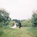 Bride and Groom Posing in the Countryside