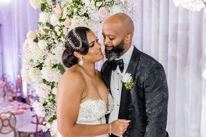 Bride With Drop Earrings and Crystal Headpiece and Groom With Black, Detailed Jacket