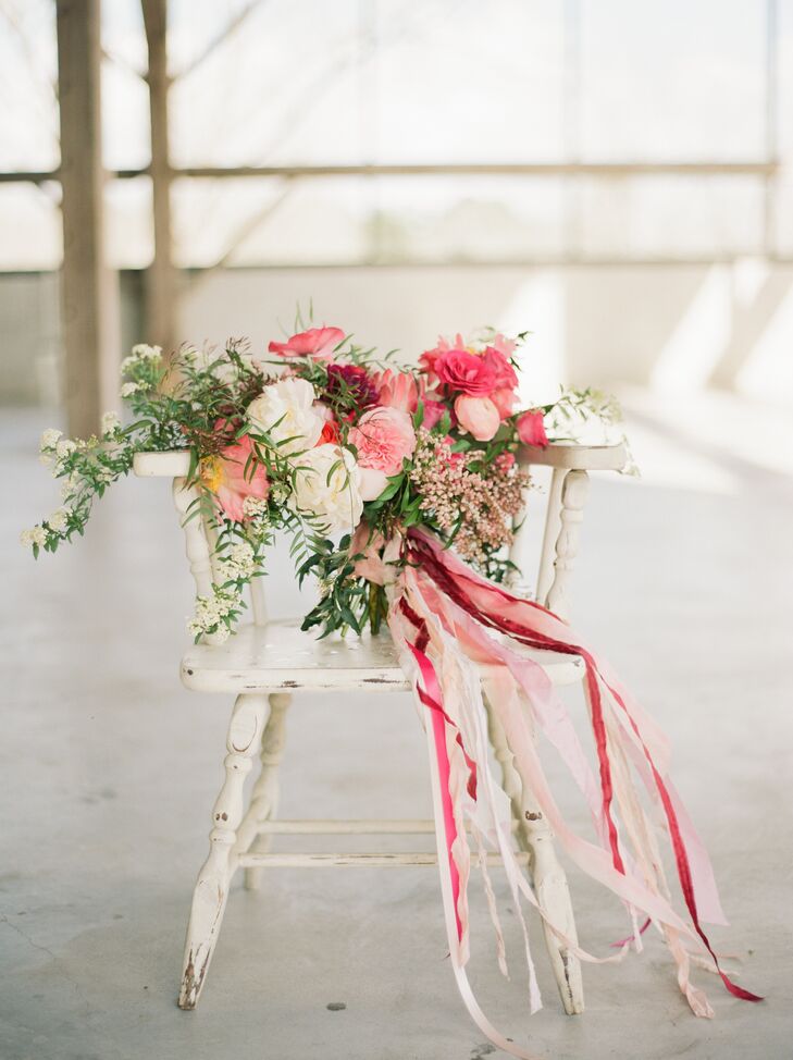 "My bouquet was not only lovely in colors but also huge—just the way it should be in Texas," says Deborah, who had Flower Vibes create a colorful arrangement in varying shades of pink with king proteas, ranunculus, anemones, garden roses and peonies.