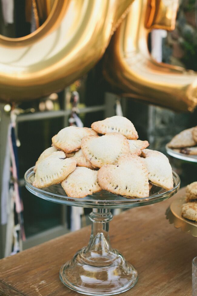 “I love desserts an insane amount, so we went pretty hard in that area,” Sarah says. In addition to a delicious two-tier cake by Sweet and Saucy Shop, Sarah and Brendon offered a dessert bar packed with cake pops, cupcakes, mini tarts, mini pies, cookies and mousse shooters.