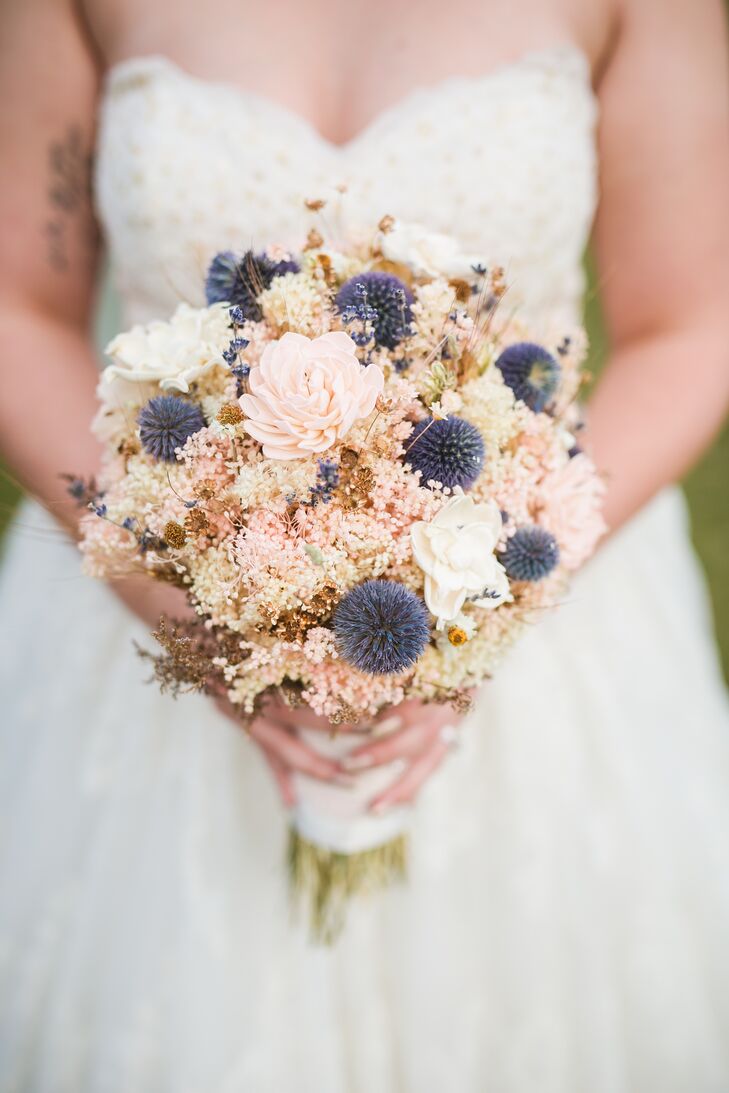 Marianne carried a beautiful bouquet with thistles, wildflowers and dried flowers in lavender, blush and ivory. "Dried flowers are awesome because you get to keep them after!" Marianne says.