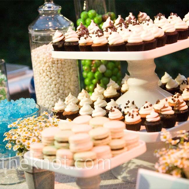 In addition to a wedding cake, Courtney and Andrew offered a dessert bar with macaroons, mini cupcakes, blue and white candy, and other sweets.