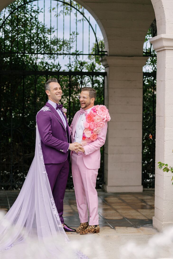 Grooms in Bold Purple and Pink Tuxedos With Unique Floral and Tulle-Cape Accessories