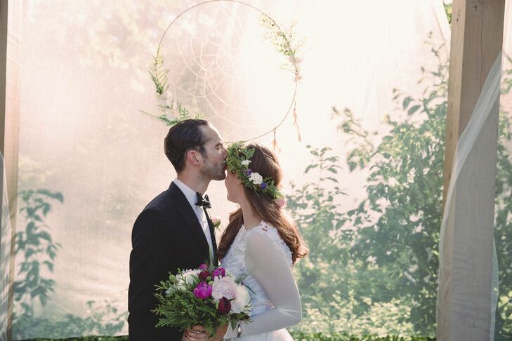 After the service, Lauren and Paul took a few moments alone by their dream catcher backdrop. Lauren’s flower crown captured it’s natural style with lush greenery, purple wildflowers and pink peonies all wrapped into the band. The design was also an ideal match to her textured peony bouquet from Risher Van Horn Flowers.