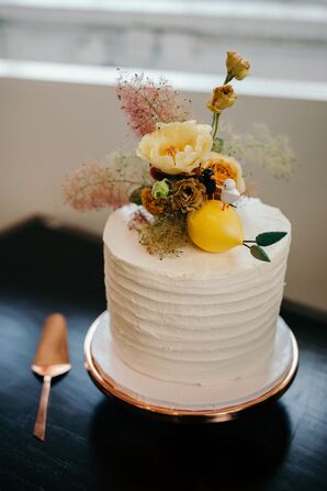 Ridged Buttercream Cake with Cake Flowers and Lemon Decoration