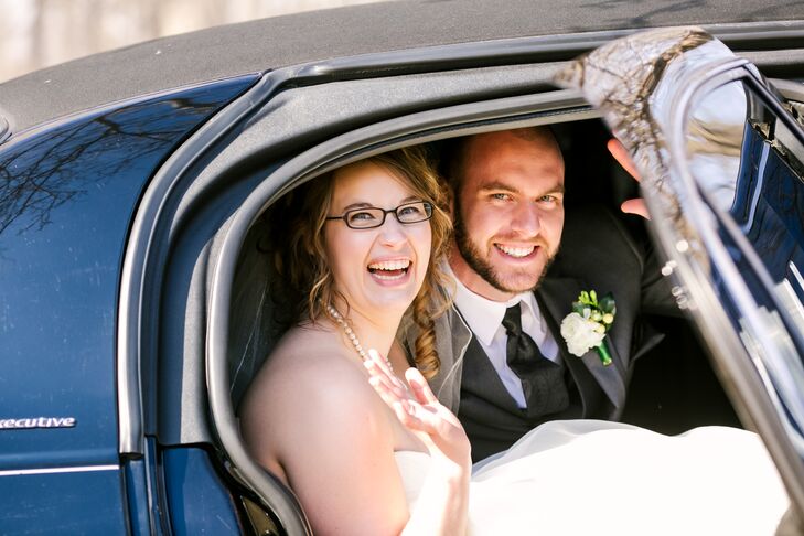 Jeannine Marie Photography snapped this shot of the bride and groom looking happy in the limo.