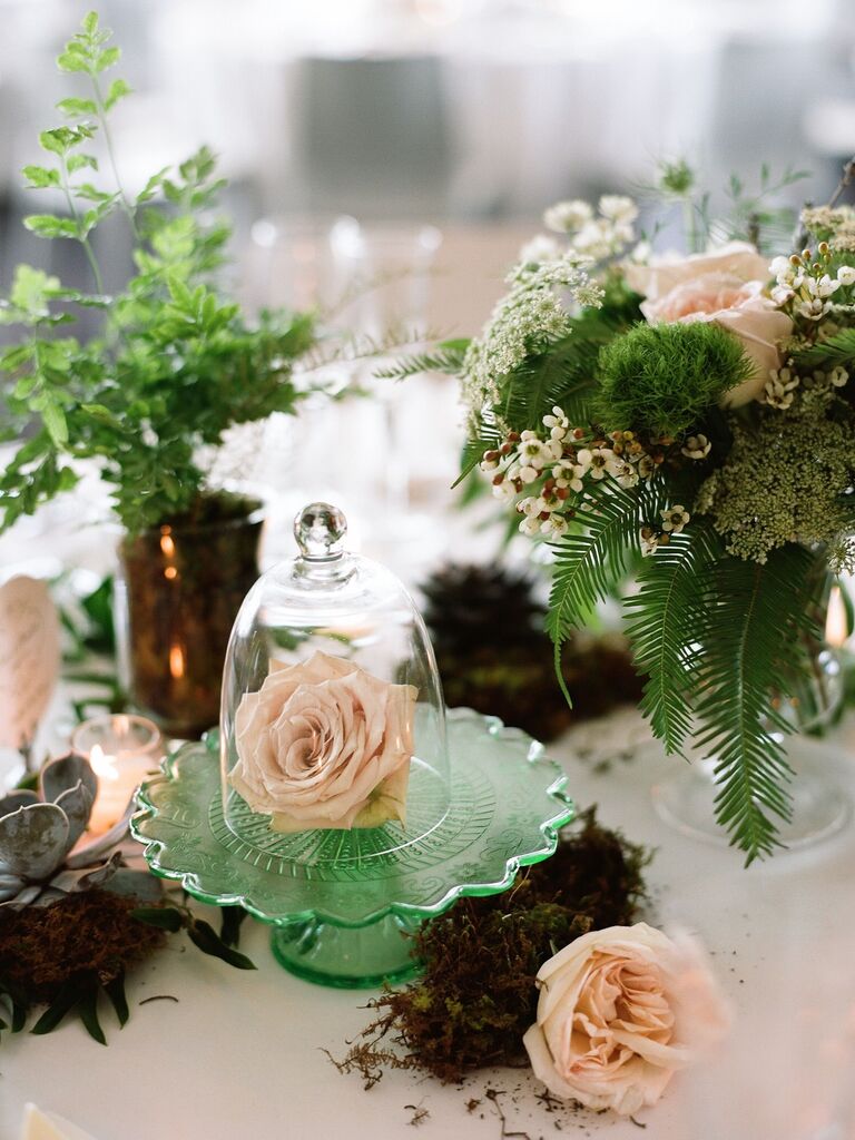 A delicate cloche floral centerpiece.