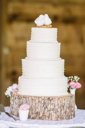 White Buttercream Wedding Cake on Wooden Slab