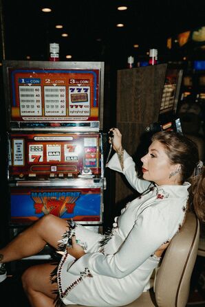 Wife Playing Casino Slot Machine in Las Vegas