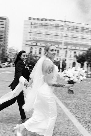 Black-and-White Action Photo of Brides Running in San Francisco