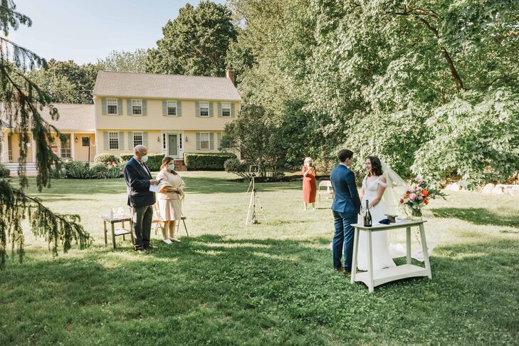 Vow Exchange During Backyard Minimony in Reading, Massachusetts