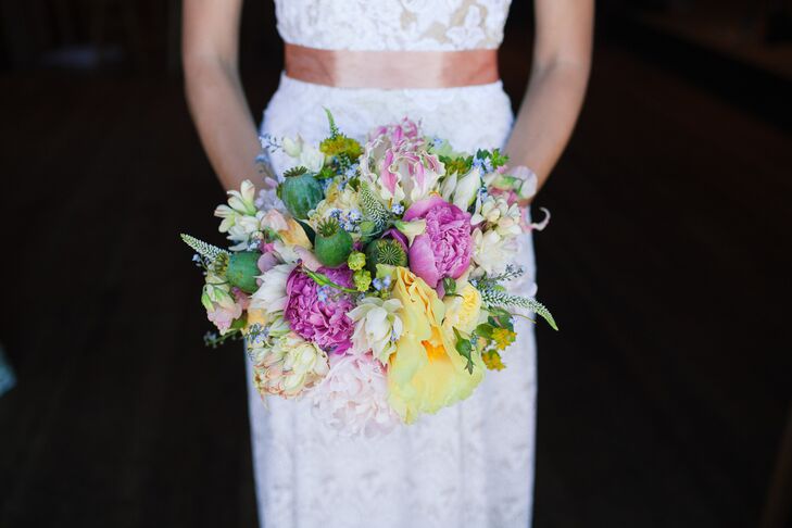 Holly held her pastel-colored bouquet filled with roses, lilies, veronica, poppy pods and, last but not least, peonies. "I love peonies, and I wanted flowers and colors that were natural and blended well with the beautiful outdoor setting," Holly says. "Doug's mom is an amazing florist, and she came up with so many creative ideas and beautiful, natural and textured bouquets."