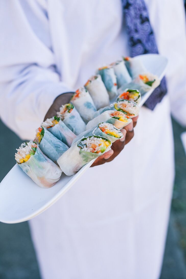 Mango summer rolls were served as passed appetizers, among many other fresh dishes for guests to enjoy, all catered by Alex's Catering. "We had fresh mango summer rolls with a chili sauce, ahi tuna avocado poke cones and chicken wrapped in pancetta for passed appetizers," Holly says. "For dinner, we had a buffet with homemade ravioli, several seasonal salads, grilled vegetables, steak with chimichurri sauce and free-range chicken."