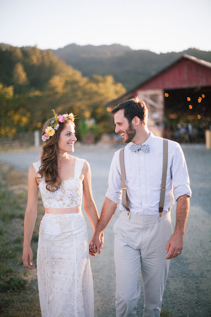 Holly wore an ivory custom-made wedding dress with a lace overlay and a peach-colored sash tied around her waist. "One of my dear friends is a seamstress, and together she and I came up with a design for my dress," Holly says. "We took elements of various dresses I'd tried on and combined them into a custom gown. She works with reclaimed materials, so we used fabrics from members of my family, such as doilies and tablecloths, to make a personal gown."
