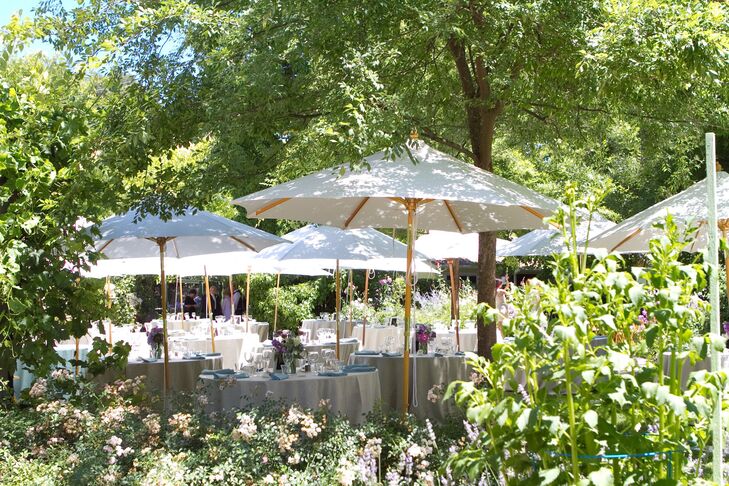 An intimate garden reception followed the ceremony. White umbrellas, pastel linens and bright summer blooms complemented the lush backdrop, adding a whimsical feel to the afternoon.