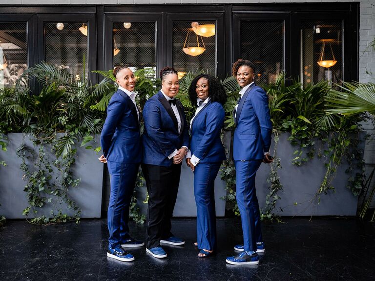 Small wedding party poses for the camera. 