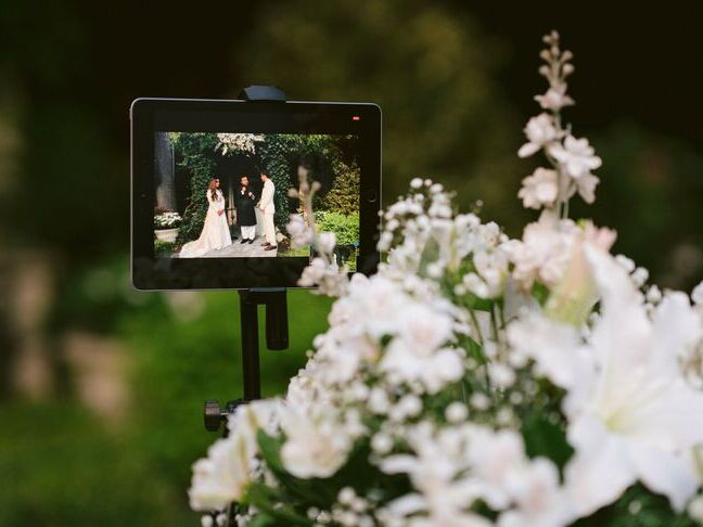 Livestream video on tablet during wedding ceremony