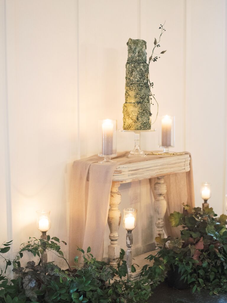ornate fall wedding cake with sculpted fondant tiers and 3D sugar flower details in sage green color