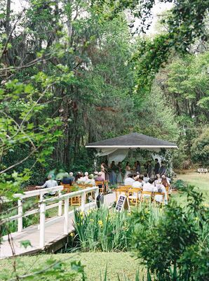 Savannah Botanical Garden Wedding Ceremony Featuring a Bride, Pond, and Flowers