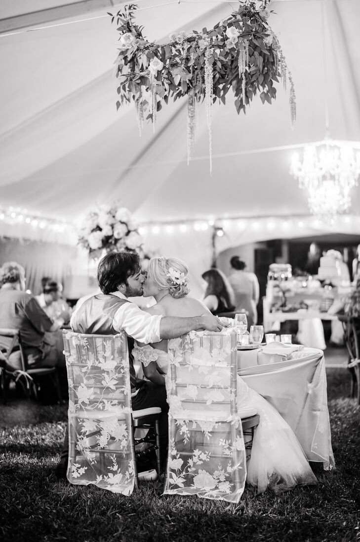 Sweetheart Table Couple with Lace Covered Chairs