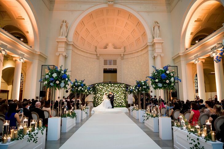 Modern, Luxurious Ceremony with Tall Aisle Decorations at the Field Museum in Chicago, Illinois