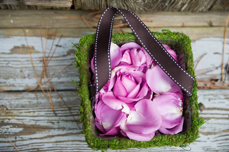 Flower girls carried moss-lined buckets full of loose petals down the aisle before the bride's processional.