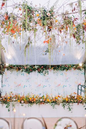 Reception Band Stage With Patterned Blue-and-Orange Backdrop