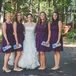 Bridesmaids Dressed in Plum Cocktail Dresses with Light Purple and Blue Clutches