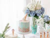 Light blue bridal shower cake with sprinkles and ice cream cone on top