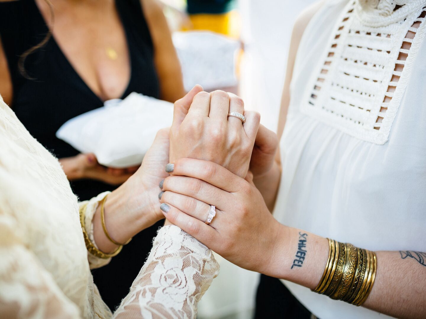 Hands of a lesbian couple during their wedding
