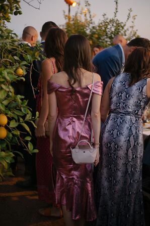 Guests Finding Dinner Seats at Long Tables in Lemon Grove at Private Santa Barbara Residence